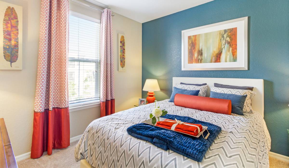 Decorative pillows arranged on a bed with luxury at Commonwealth Landing Lofts in Fall River, Massachusetts