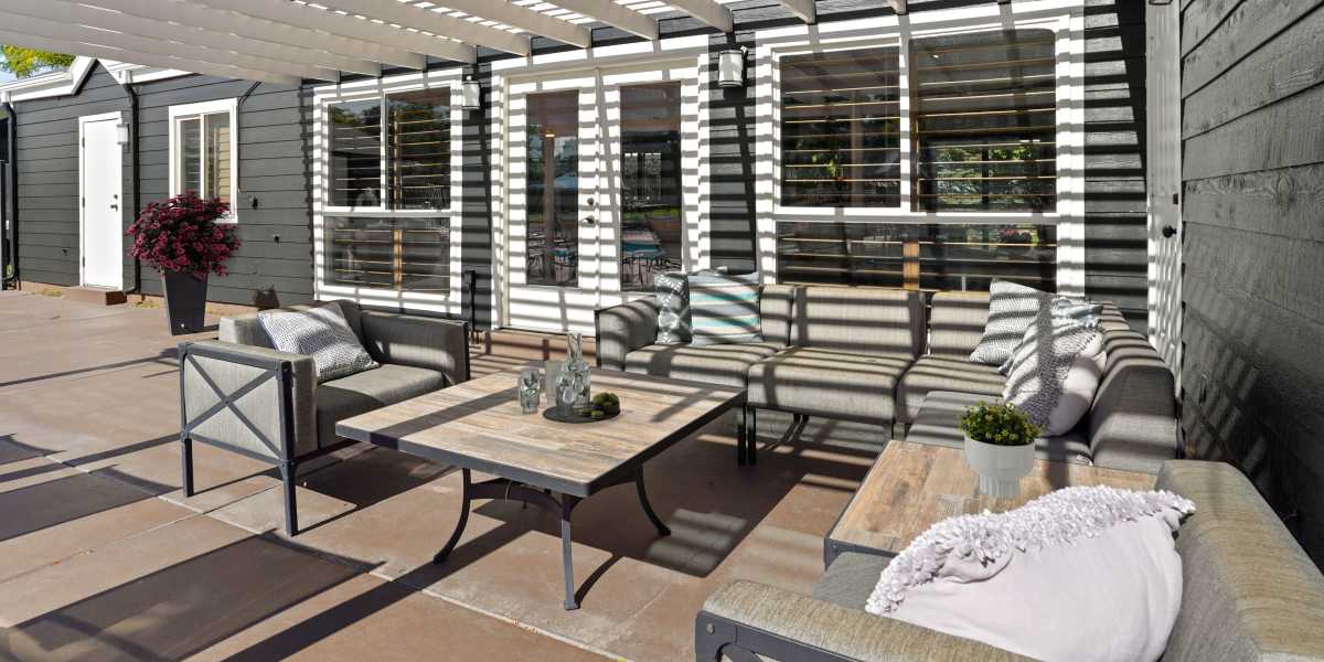 Outdoor lounge area with couches at Royal Ridge Apartments in Midvale, Utah