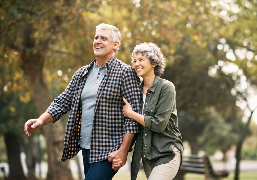 Couple on a walk through a park in Pearisburg, Virginia near Baltimore Gardens Apartments