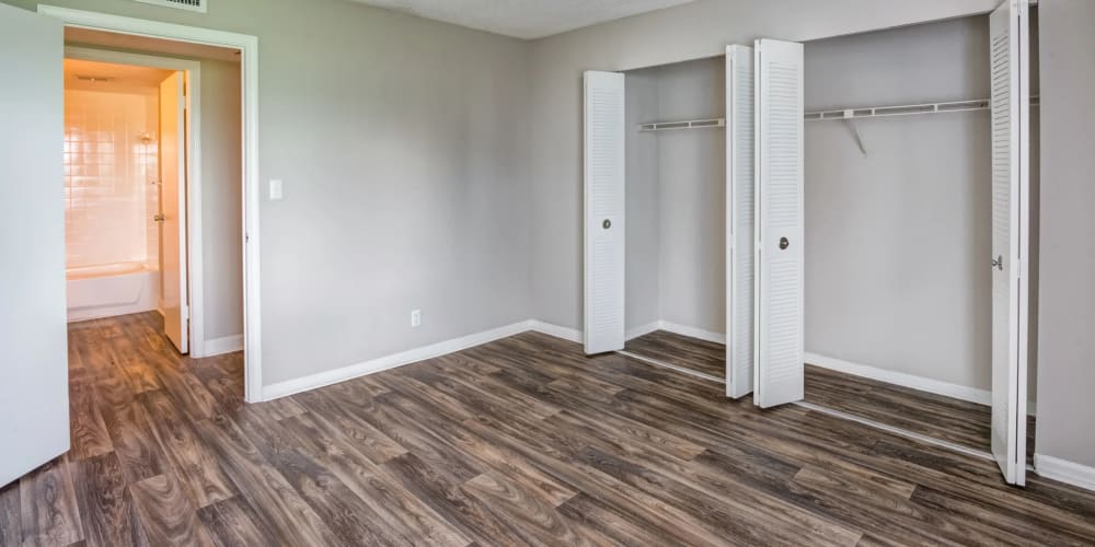 Wood-style flooring in an apartment bedroom at Costa Del Lago in Lake Worth, Florida