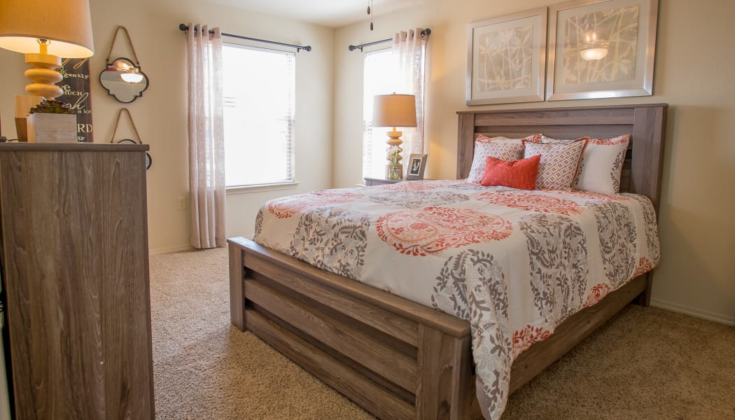 Bedroom with a ceiling fan at Mission Point Apartments in Moore, Oklahoma