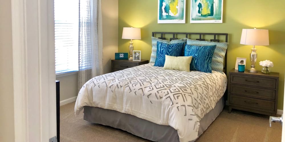 Well-furnished primary bedroom with lots of natural light at Level at 401 in Raleigh, North Carolina