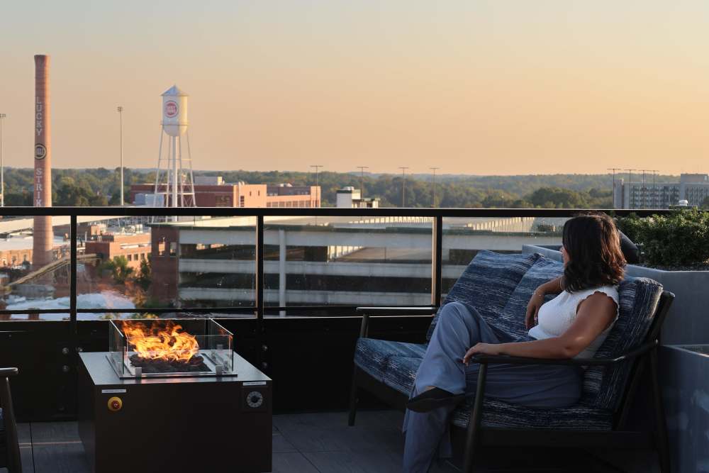 Rooftop fireplace with views of the city at The Novus Apartments in Durham, North Carolina