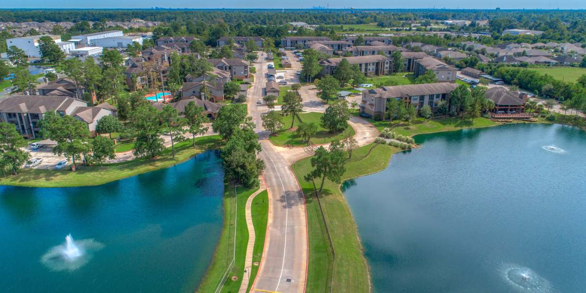 A stunning aerial view of the community with scenic lake view at Edgewater at Klein in Spring, Texas