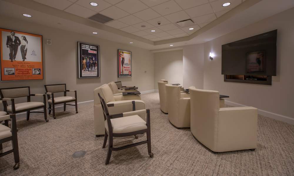 Movie theater for resident use at Keystone Place at Beachwalk in Fort Myers, Florida