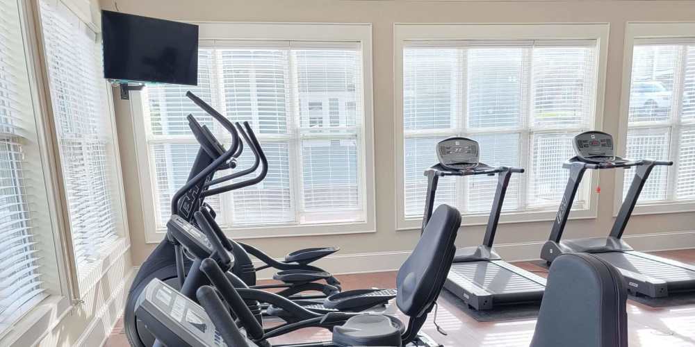 Fitness studio with treadmills and television at South Fork Village in Belmont, North Carolina