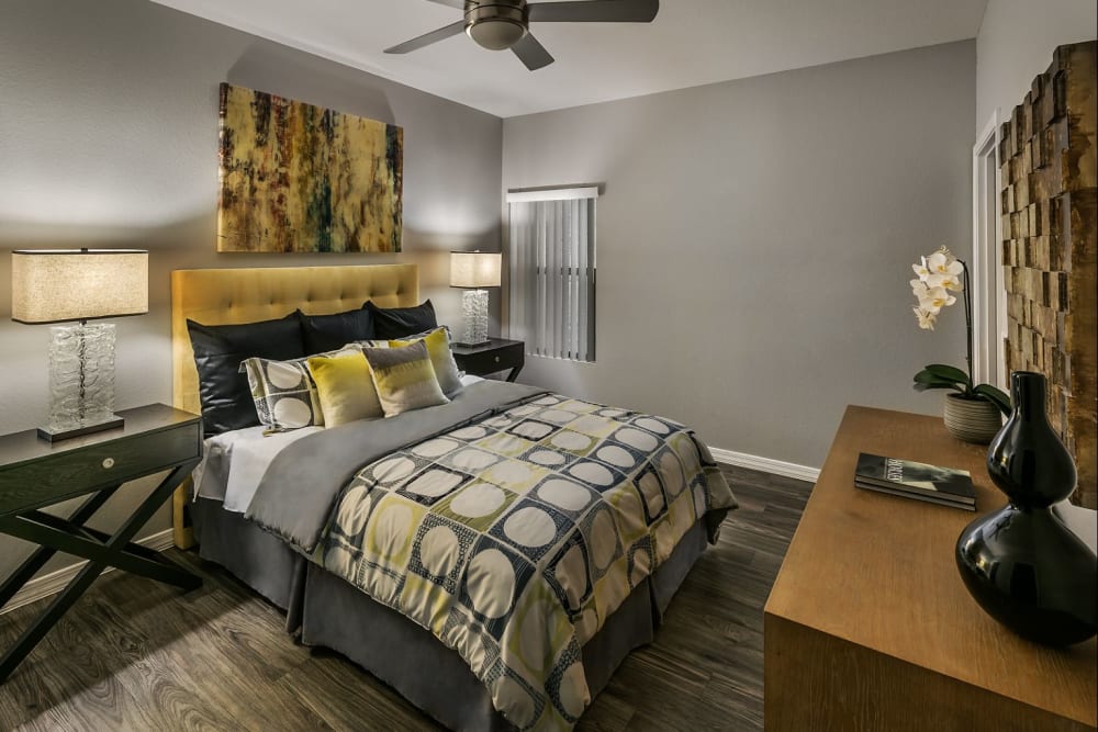 Modern bedroom with ceiling fan at Avenue 25 in Phoenix, Arizona