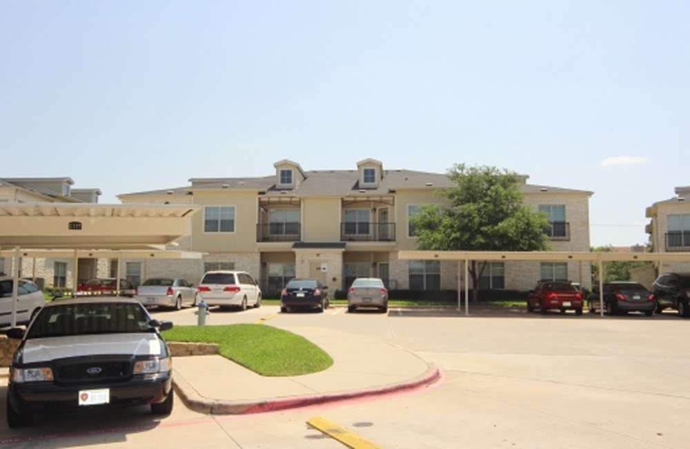Exterior view of the property at Spicewood Crossing in Carrollton, Texas