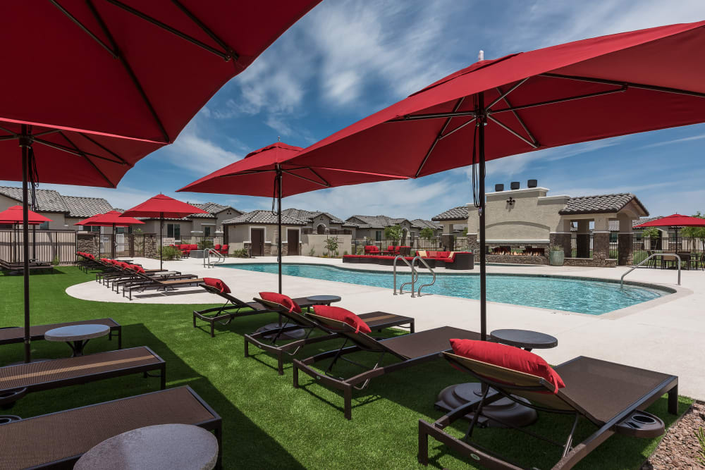 Swimming pool with a sundeck and chairs at TerraLane on Cotton in Surprise, Arizona