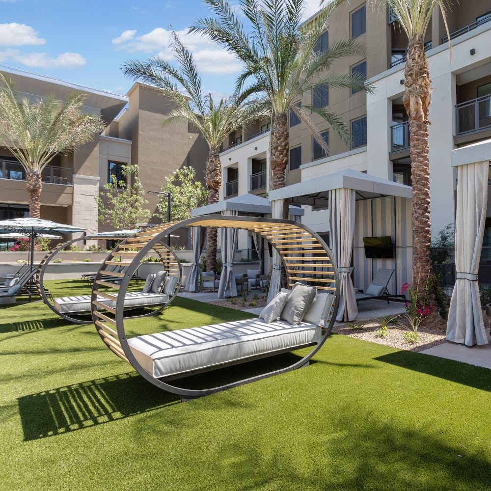 Lounge chairs next to the resort-style pool at The Aubrey in Tempe, Arizona