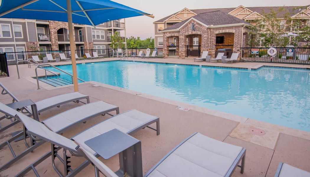 Resort style swimming pool at Cottages at Tallgrass Point Apartments in Owasso, Oklahoma
