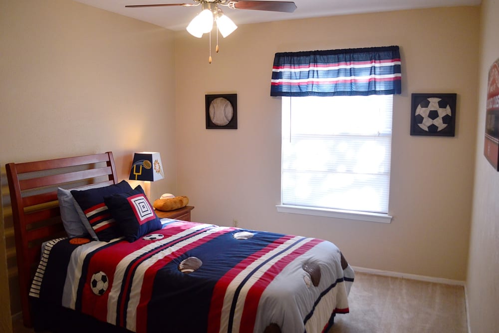 A furnished apartment bedroom at Villa Bella in Euless, Texas