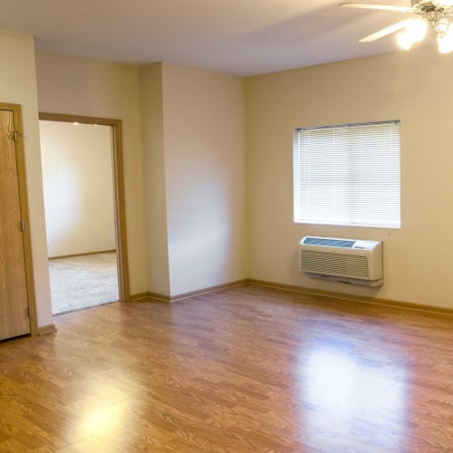 Wood flooring in the dining room and living room at Crown Point Apartments in Ames, Iowa