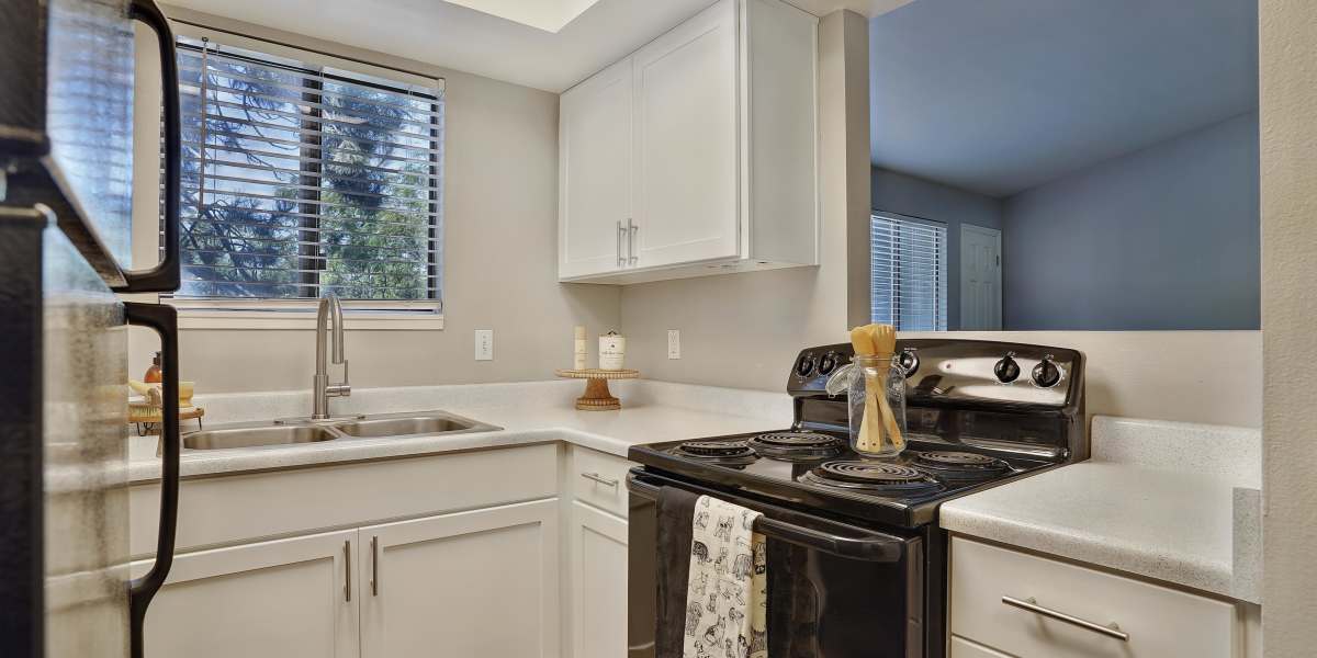 Renovated white cabinet kitchen at Royal Farms Apartments in Salt Lake City, Utah
