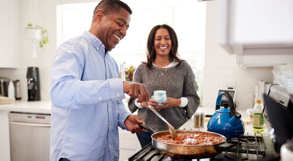 A couple prepare a meal in their gourmet kitchen at Highland Hills, Cumberland, Rhode Island 