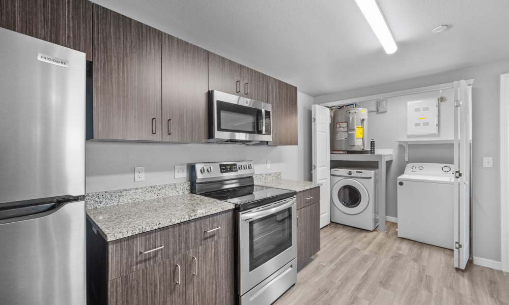 Kitchen with attached laundry area at District At Pellicano in El Paso, Texas
