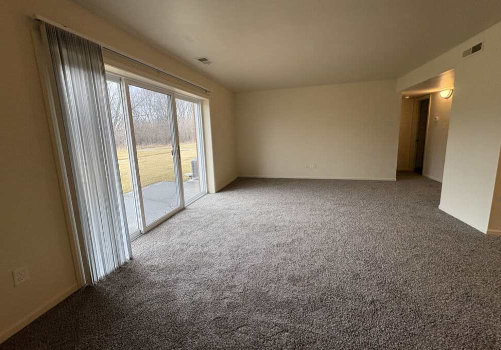 Living room with close access to patio at Mount Vernon Arms Apartments in Merrillville,Indiana