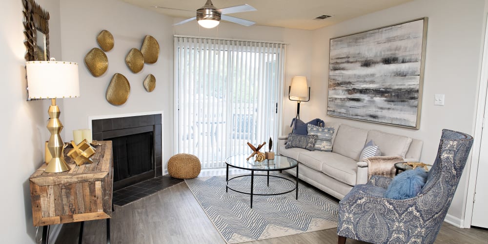 An apartment living room with a fireplace at Nine Two Six West in Augusta, Georgia