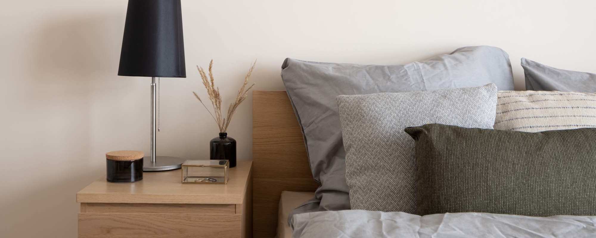 Bedroom with side table and lamp at Landmark at Dublin in Dublin, Pennsylvania