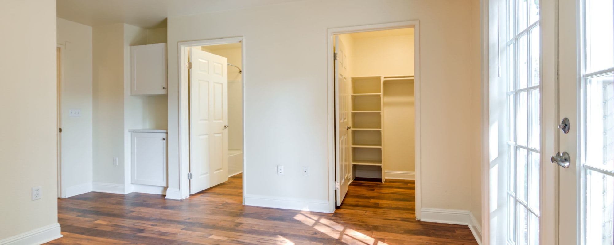 Interior view of a home with ample storage and wood flooring at Stuart Mesa in Oceanside, California
