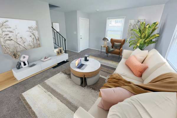 Living room with couch at Eden Green Townhomes in Columbus, Ohio