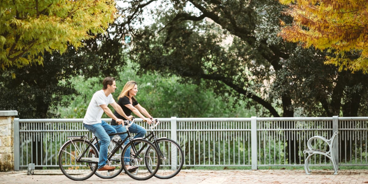 Residents biking in park in Katy, Texas near Marquis at the Reserve