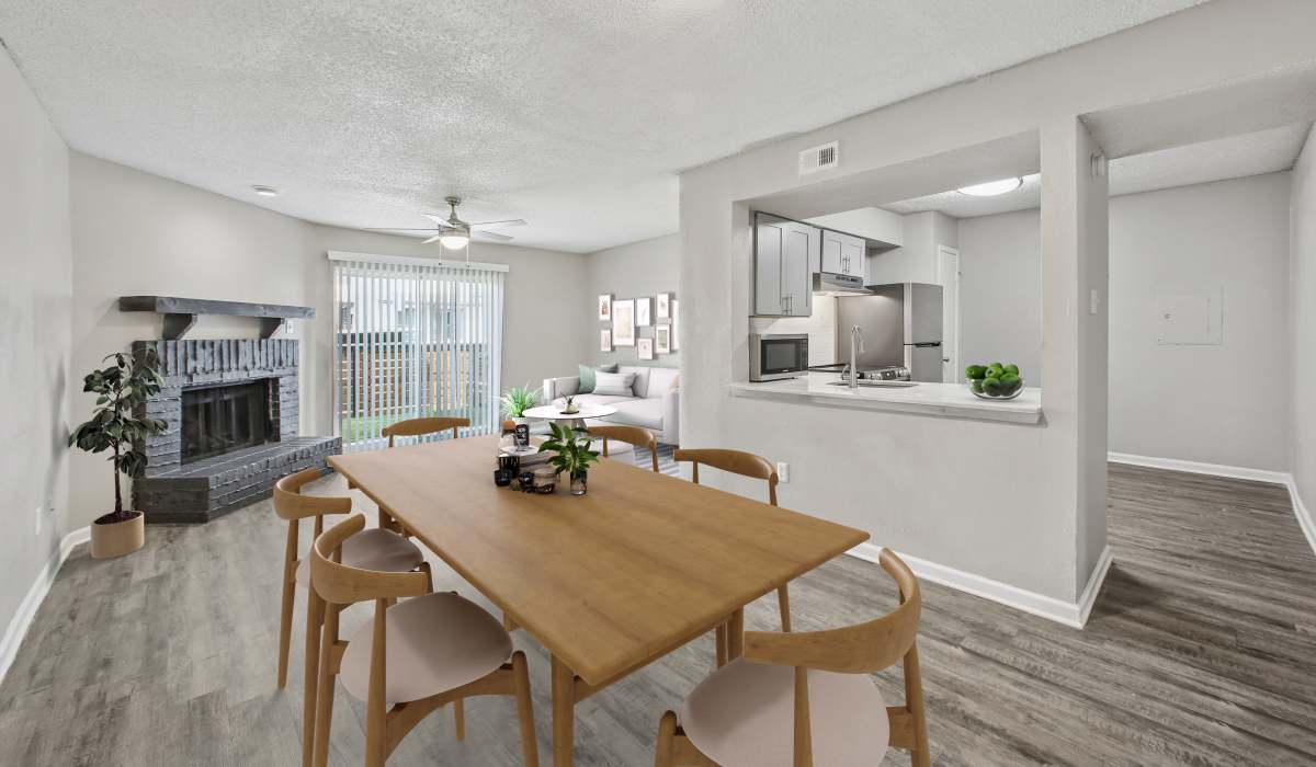 Dining room with fireplace at Fiona Apartment Homes in Irving, Texas