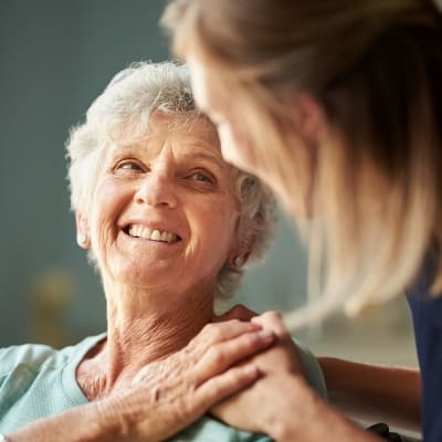 Resident smiling at caretaker at Citrus Place in Riverside, California