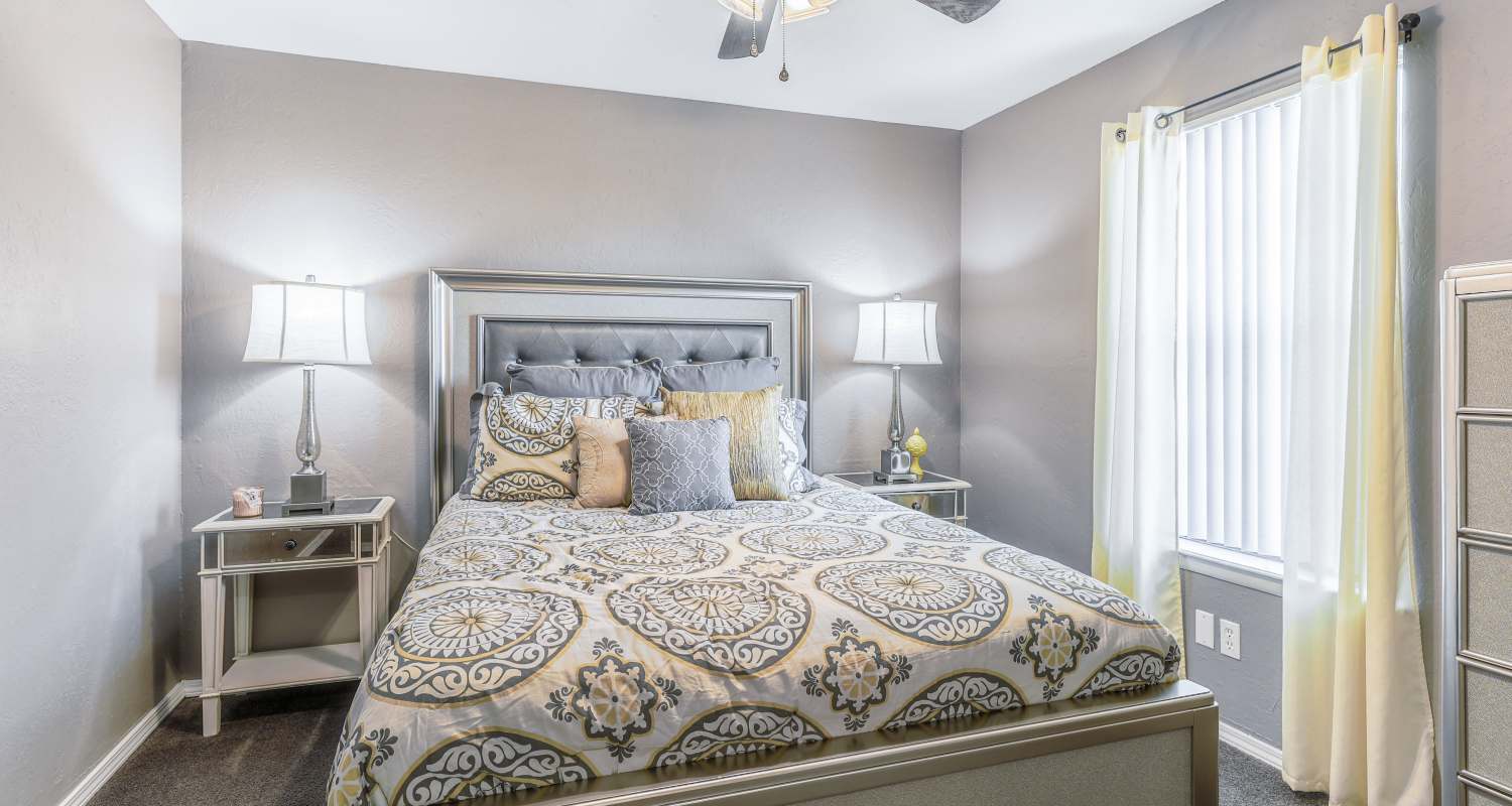 Cozy bedroom at Oxford Oaks Apartments in Edmond, Oklahoma