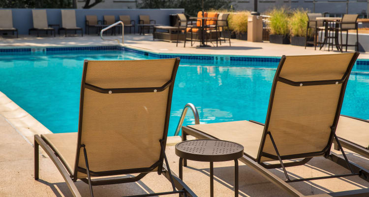 Sun chairs by the pool at Prospect Place in Hackensack, New Jersey