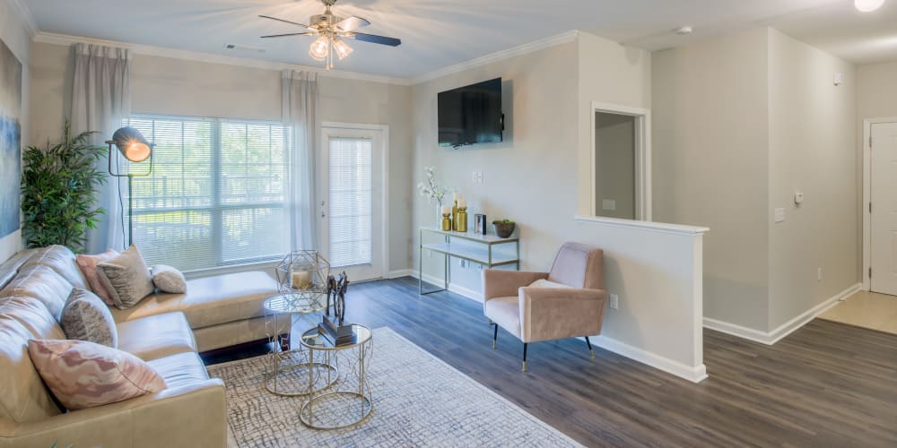 Open concept floor plan with hardwood floors and modern decor at The Vive in Kannapolis, North Carolina