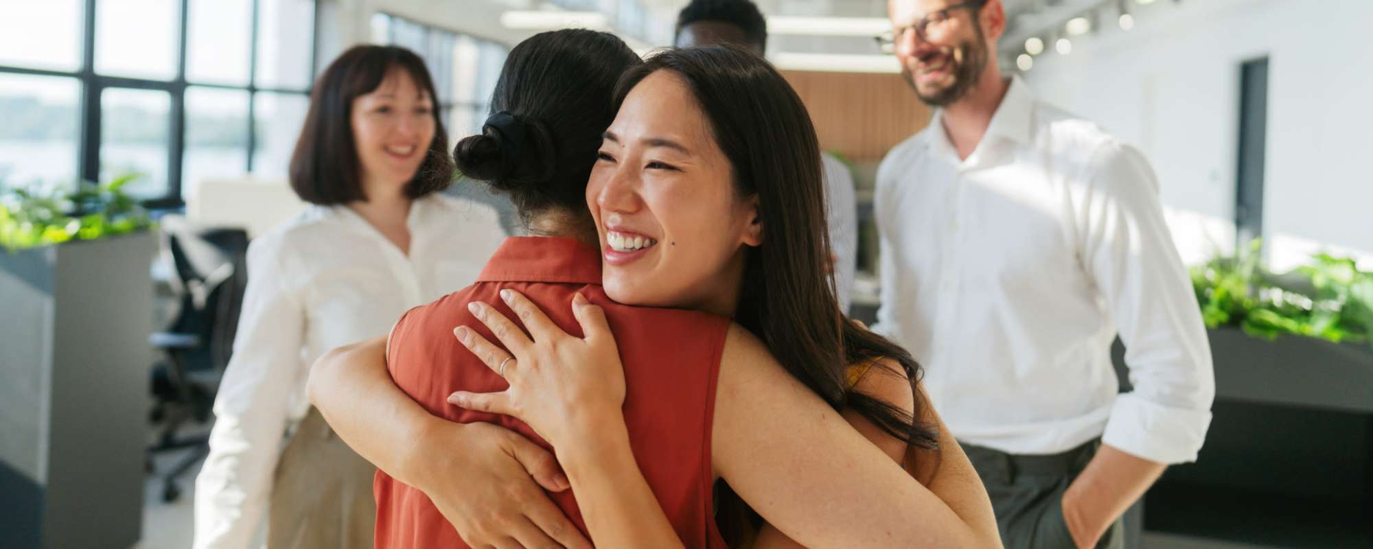 Happy family gathering at ARTISAN Management Group in Des Moines, Iowa