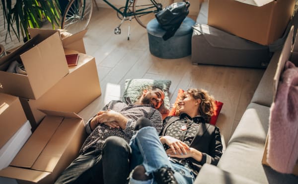 A couple taking a break from packing boxes for storage at Downtown Self Storage - Davis Street in Portland, Oregon