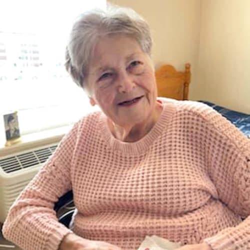 Resident seated in her apartment at Alderbrook Village in Arkansas City, Kansas