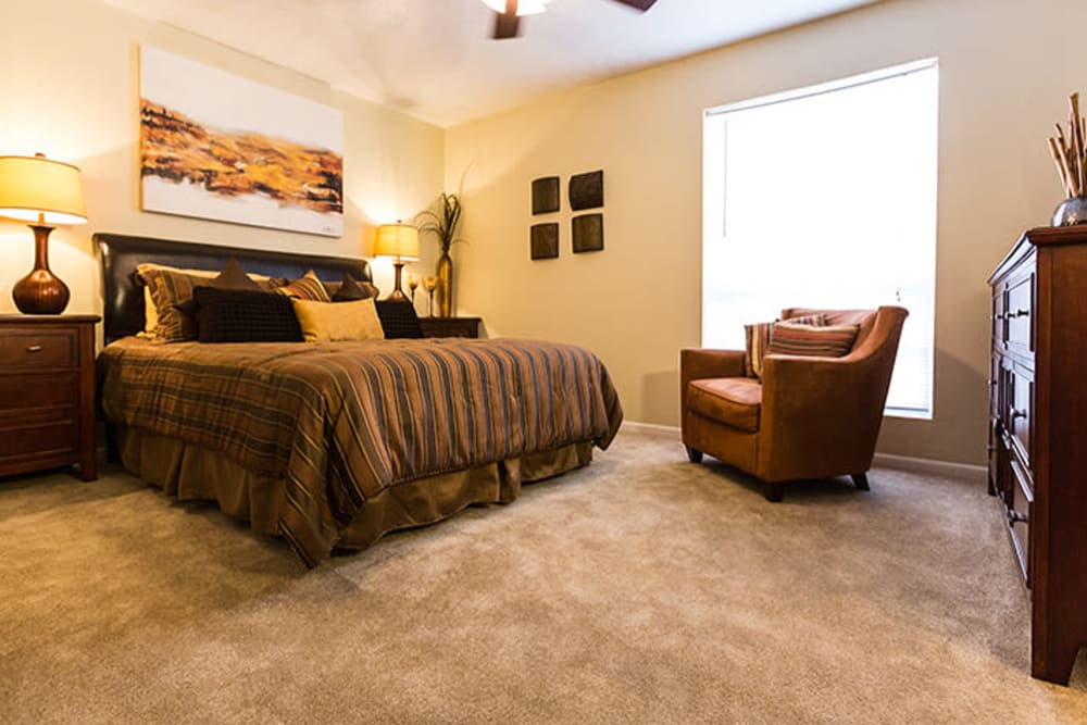 Model bedroom at Riverstone Apartments in Bryan, Texas