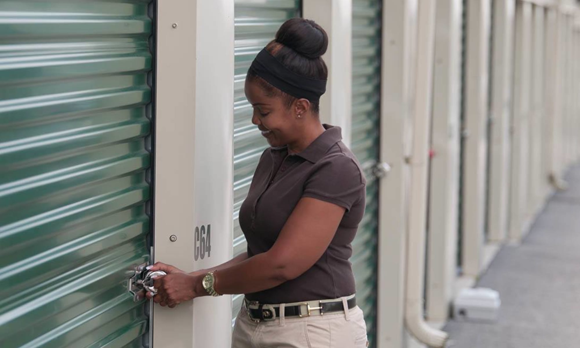 A customer secures her unit at Virginia Varsity Storage in Christiansburg, Virginia