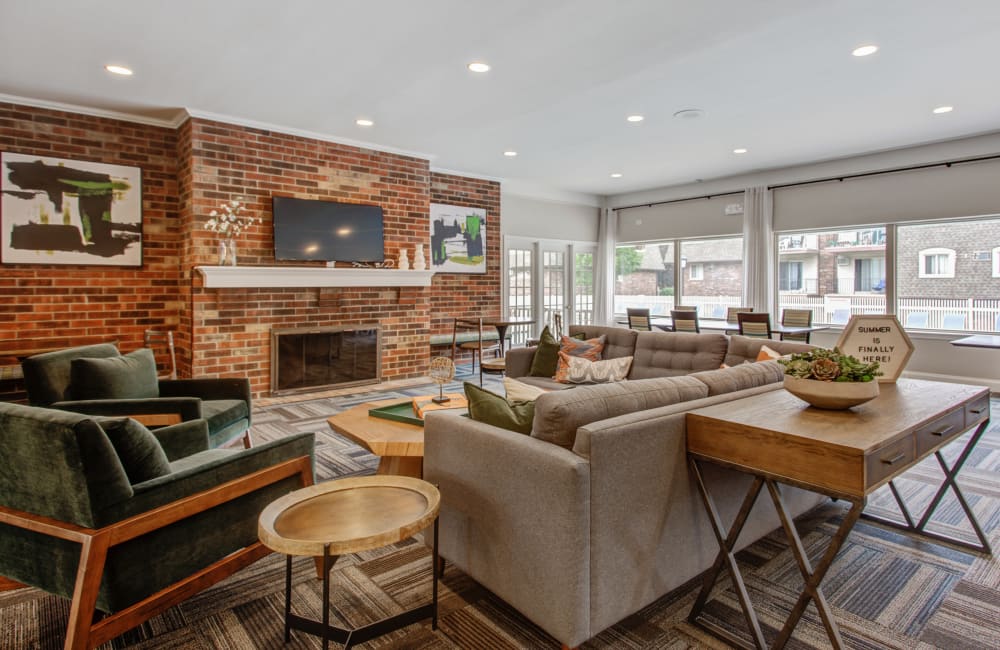 Sitting area in front of the fireplace at Blackhawk Apartment Homes in Elgin, Illinois
