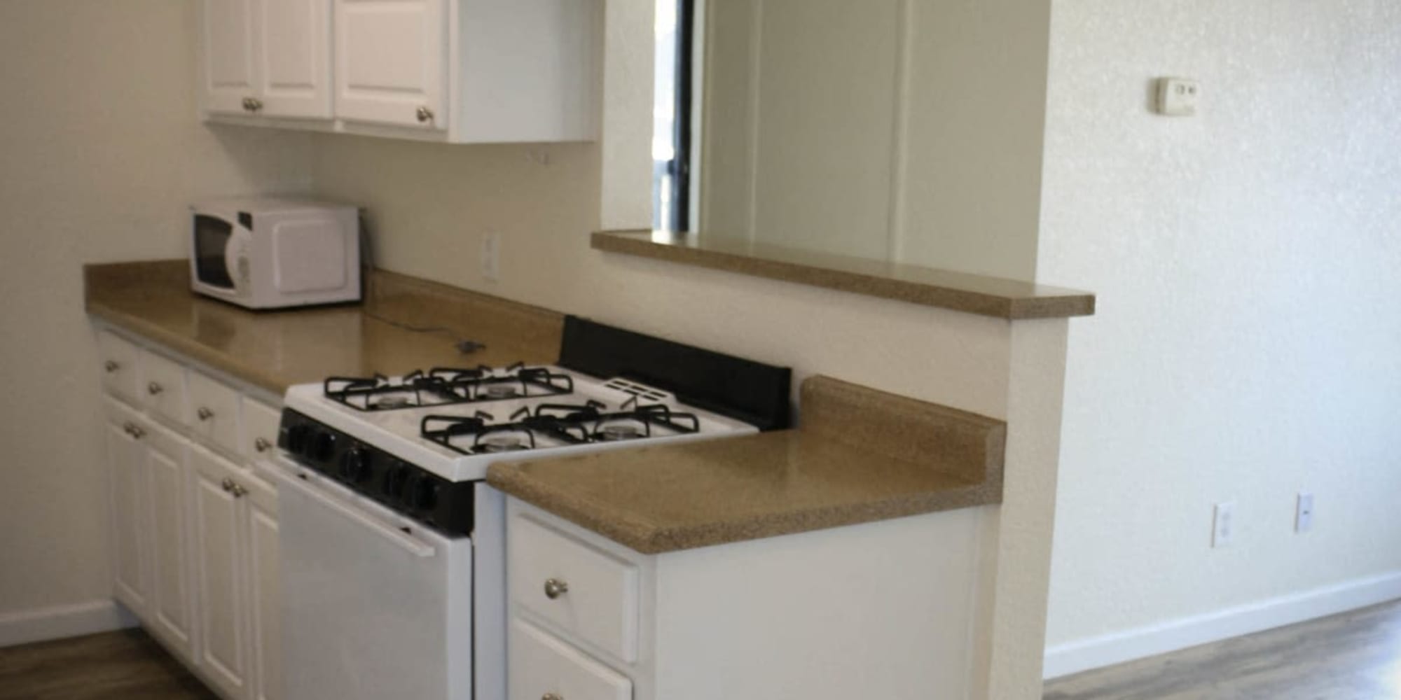 Kitchen with gas stove at Oak Park in Turlock, California