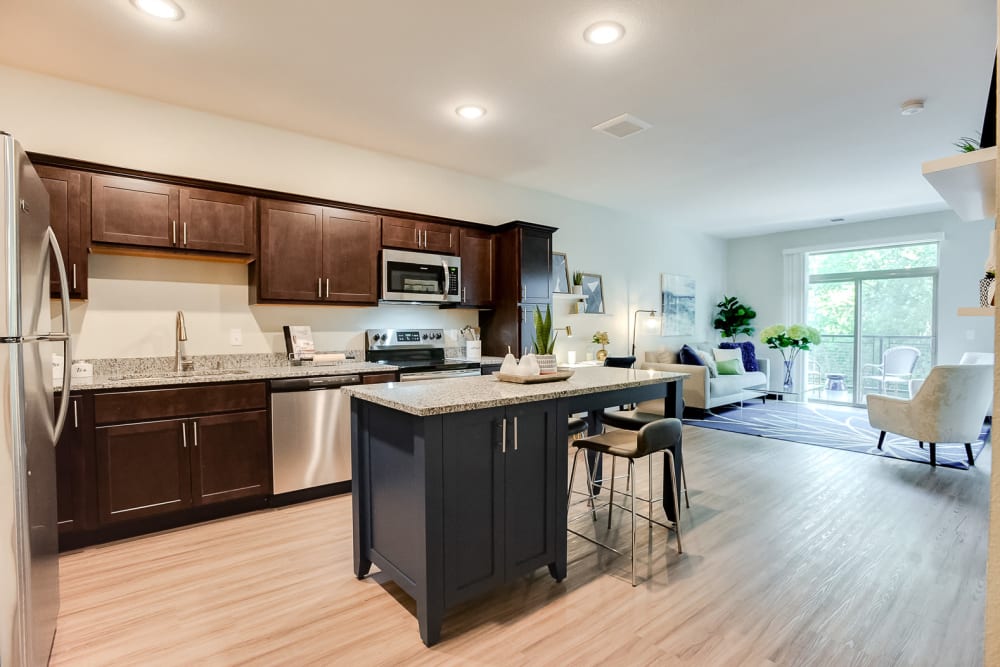 Open kitchen with plenty of cabinet space at Lake Jonathan Flats in Chaska, Minnesota