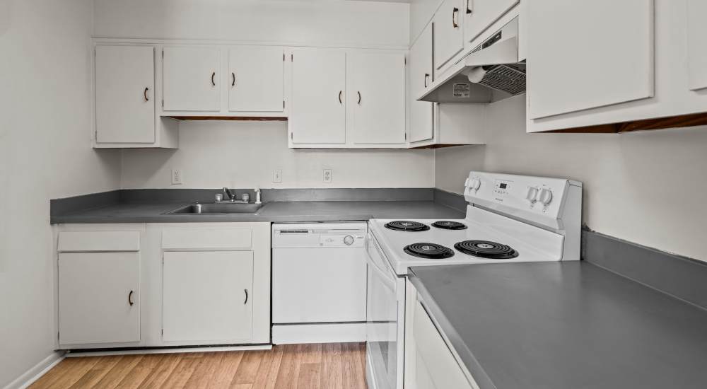 Cozy kitchen with white appliances at Falcon House in Fort Walton Beach, Florida
