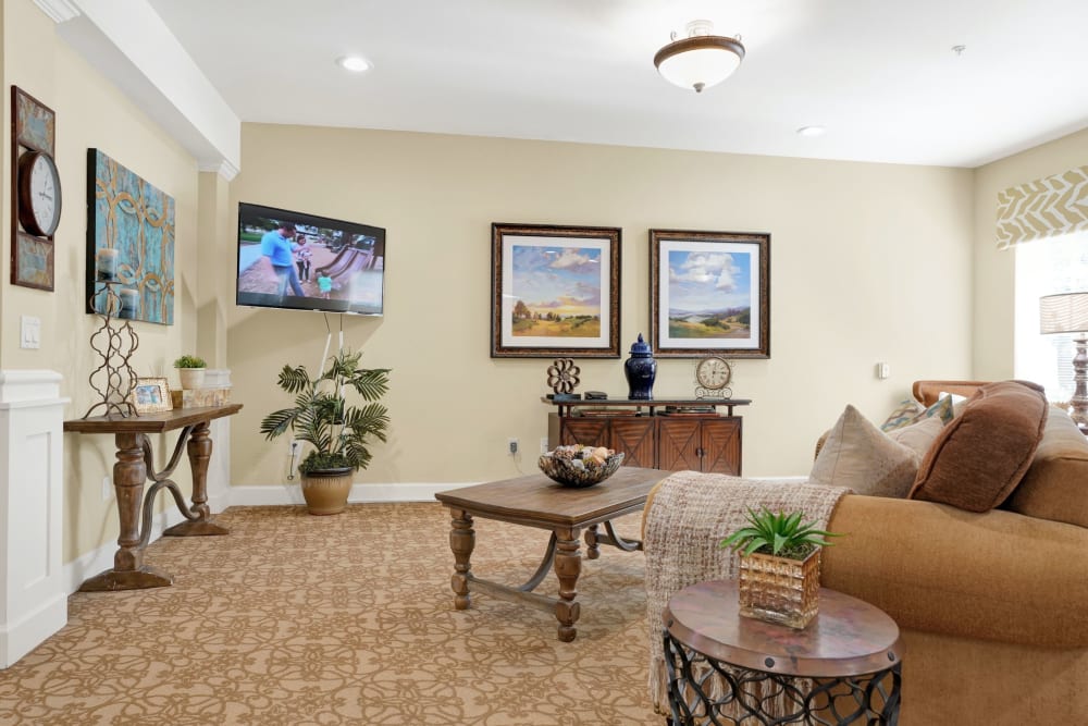 Living room in senior living apartment at The Commons at Elk Grove in Elk Grove, California