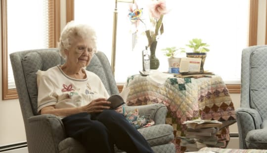 Senior reading at Meadow Ridge Senior Living