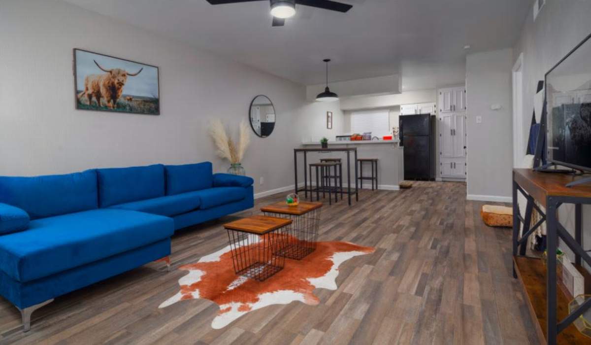 Spacious living room with wood-style flooring at Flats On Wakefield in San Antonio,Texas