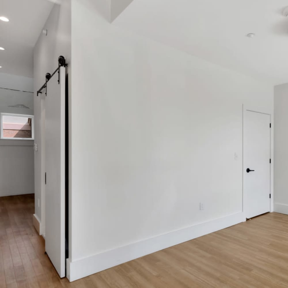 Un furnished area with wooden flooring and door at 189 Barksdale in Memphis, Tennessee