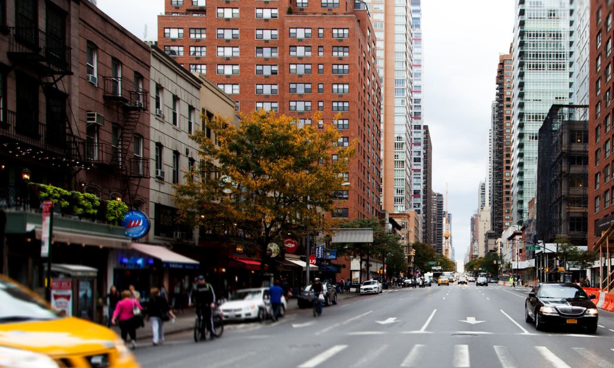 Urban street view with taxis near 301 E 94th Street in New York, New York