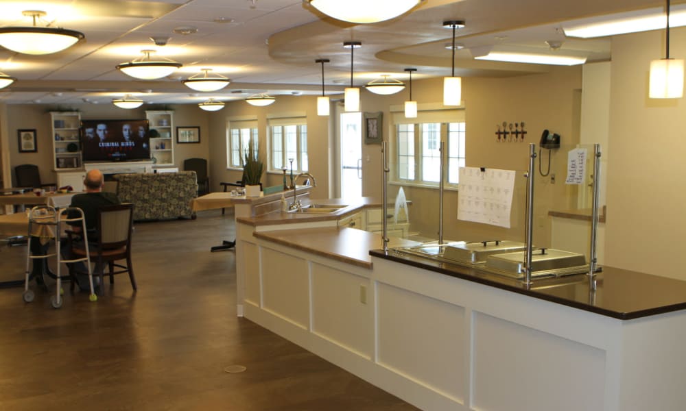 Media room and kitchen area at Holton Manor in Elkhorn, Wisconsin