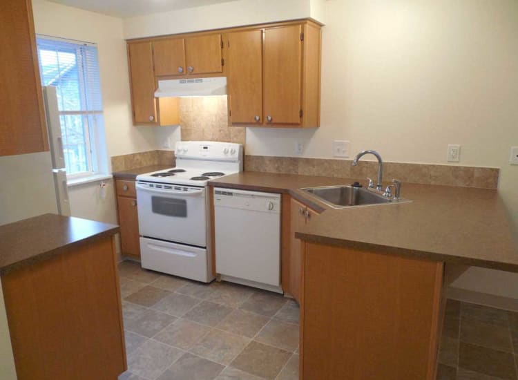 Well-lit kitchen at Conifer Place Apartments in Corvallis, Oregon