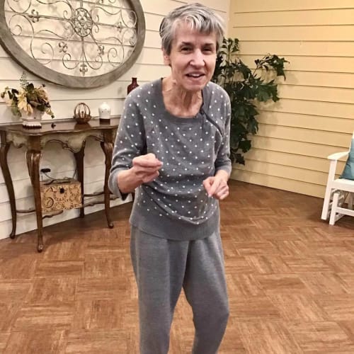 Resident dancing at Oxford Glen Memory Care at Carrollton in Carrollton, Texas