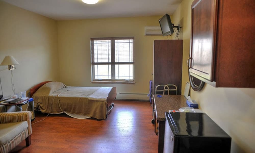 Private resident room with mini fridge at Geneva Lake Manor in Lake Geneva, Wisconsin