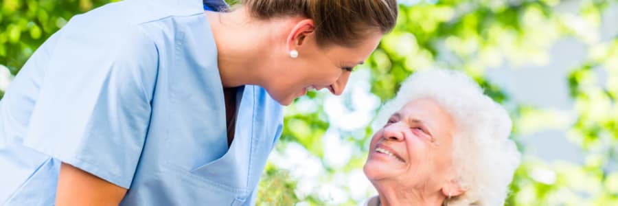 Resident and nurse smiling at eachother at Ingleside Communities in Mount Horeb, Wisconsin